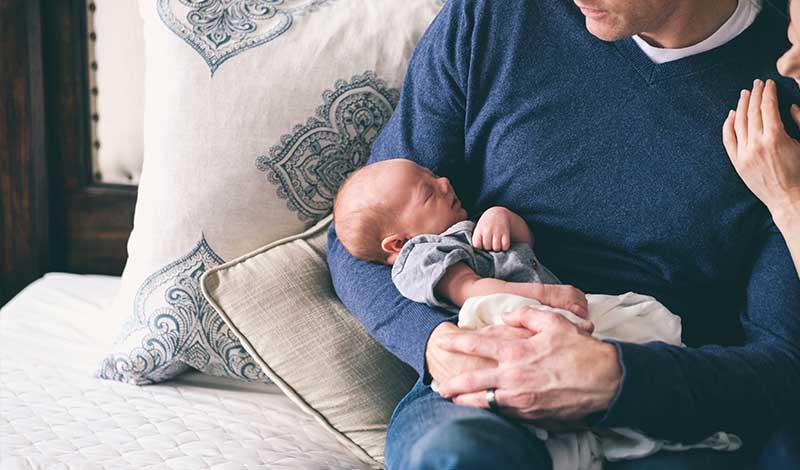 Parents with baby sleeping